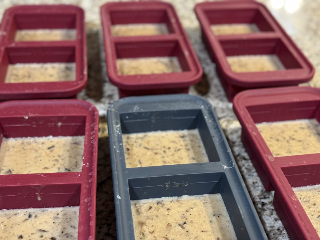 Homemade cream of mushroom soup portioned into silicone molds for freezing